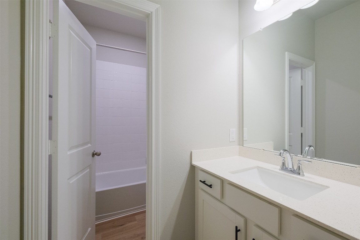 6434 New York Street Houston, TX 77021 - Photo 25 of 27 a bathroom with a sink and a mirror