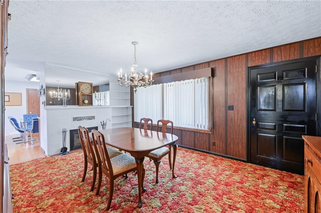 612 Methodist Road Greenville, PA 16125 - Photo 35 of 48 FORMAL D.R. W/FIREPLACE AND BAY WINDOW/EXIT DOOR TO FRONT OF HOME