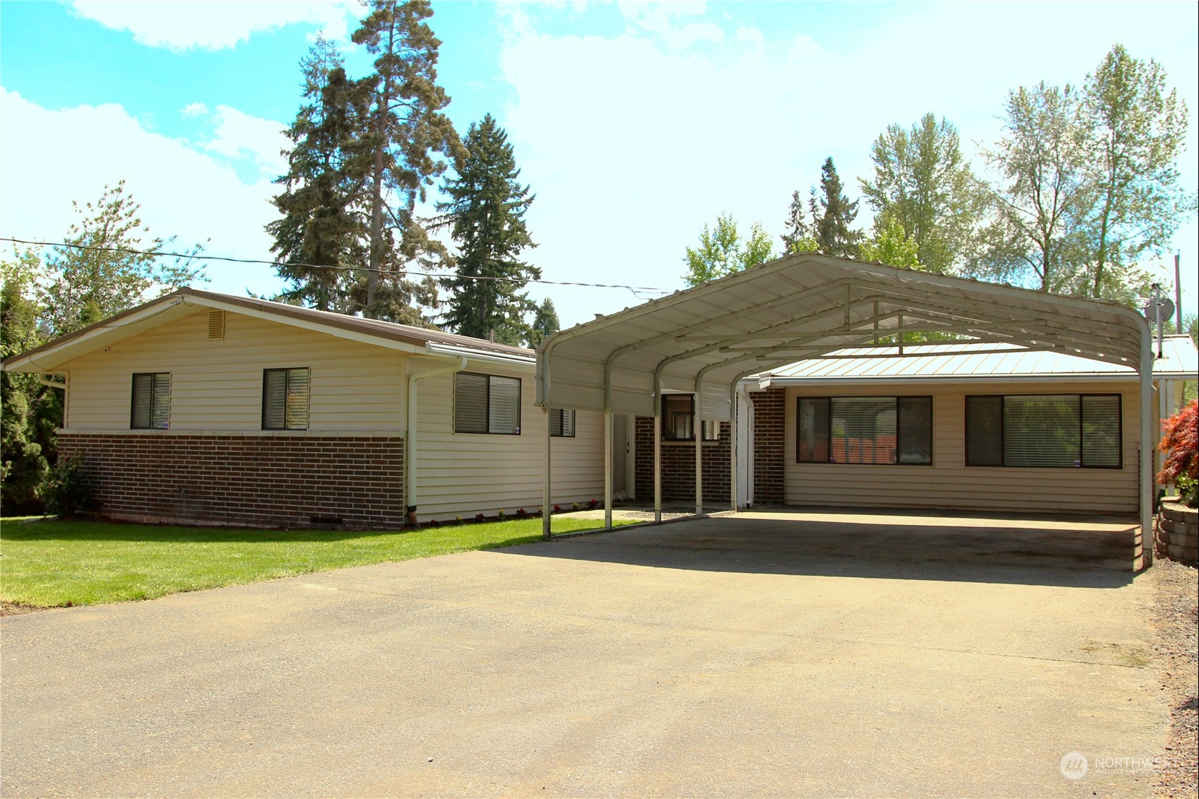 18817 Southeast 134th Street Renton, WA 98059 - Photo 1 of 27 a front view of a house with a garden