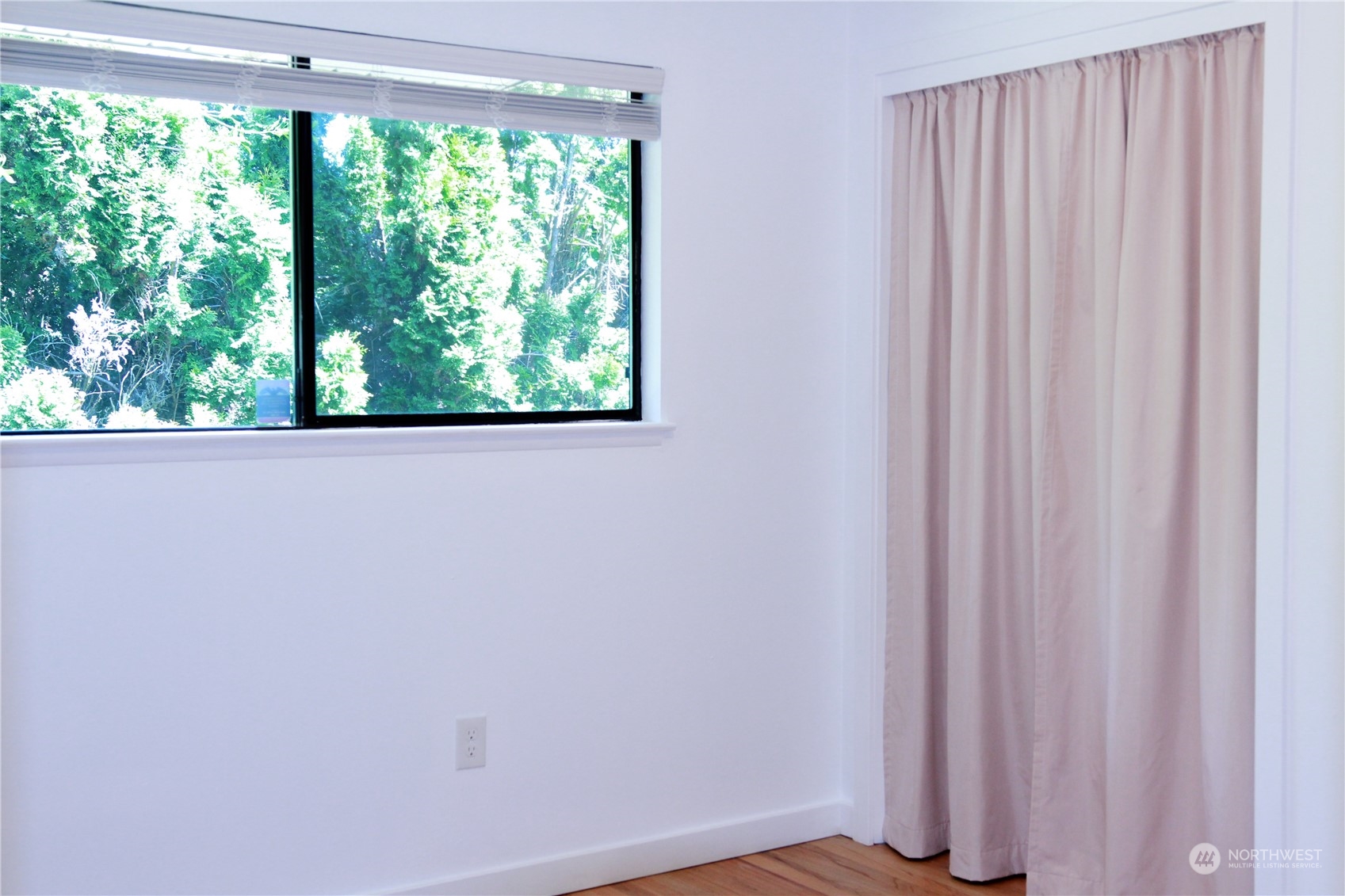 18817 Southeast 134th Street Renton, WA 98059 - Photo 13 of 27 a view of a small space with wooden floor and doors