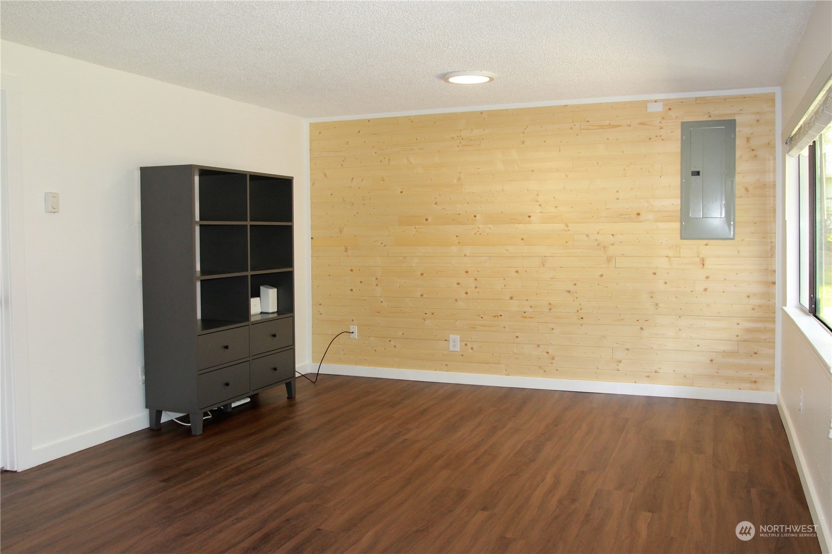 18817 Southeast 134th Street Renton, WA 98059 - Photo 16 of 27 wooden floor in an empty room with a window