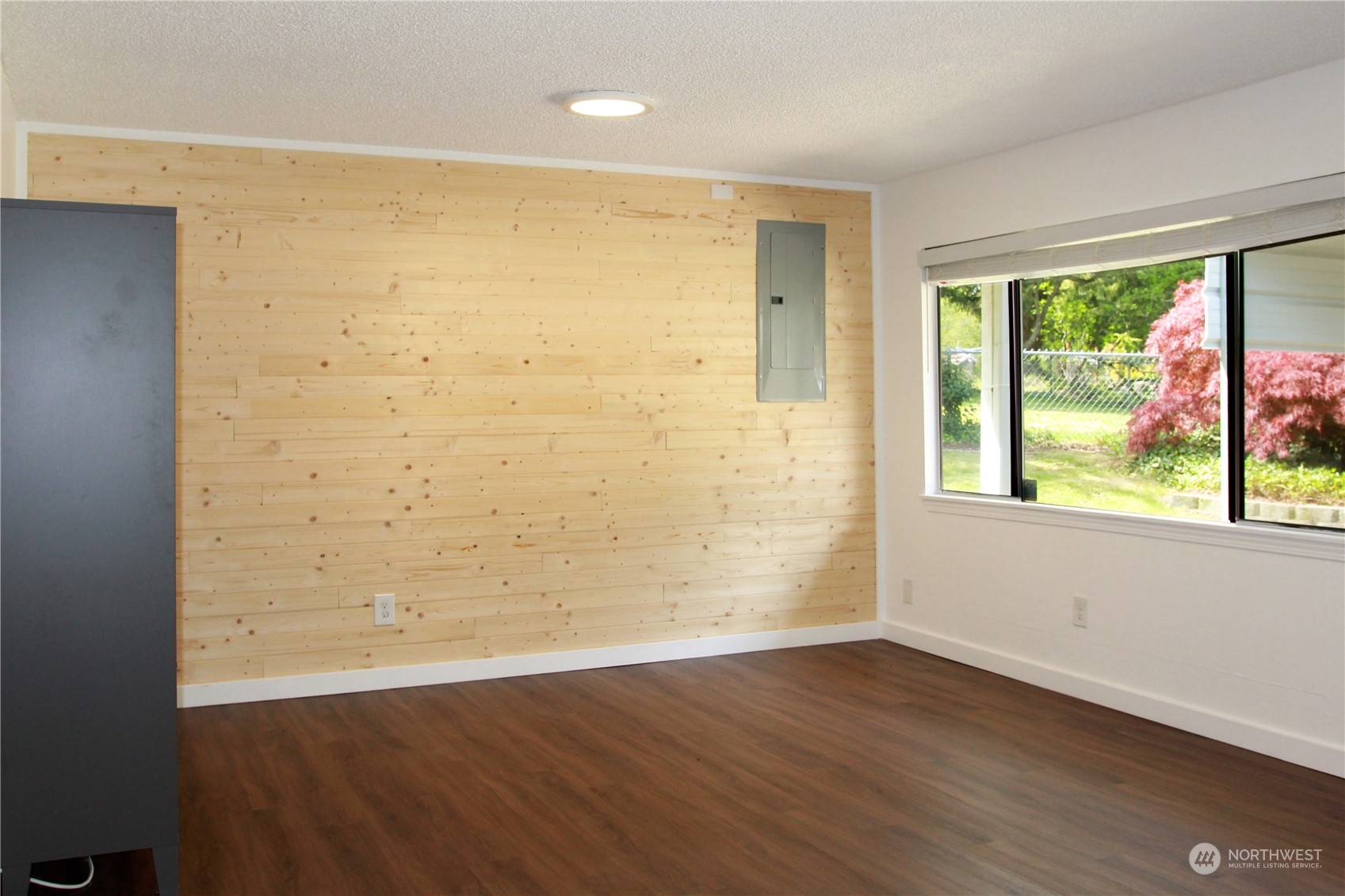 18817 Southeast 134th Street Renton, WA 98059 - Photo 17 of 27 wooden floor in an empty room with a window