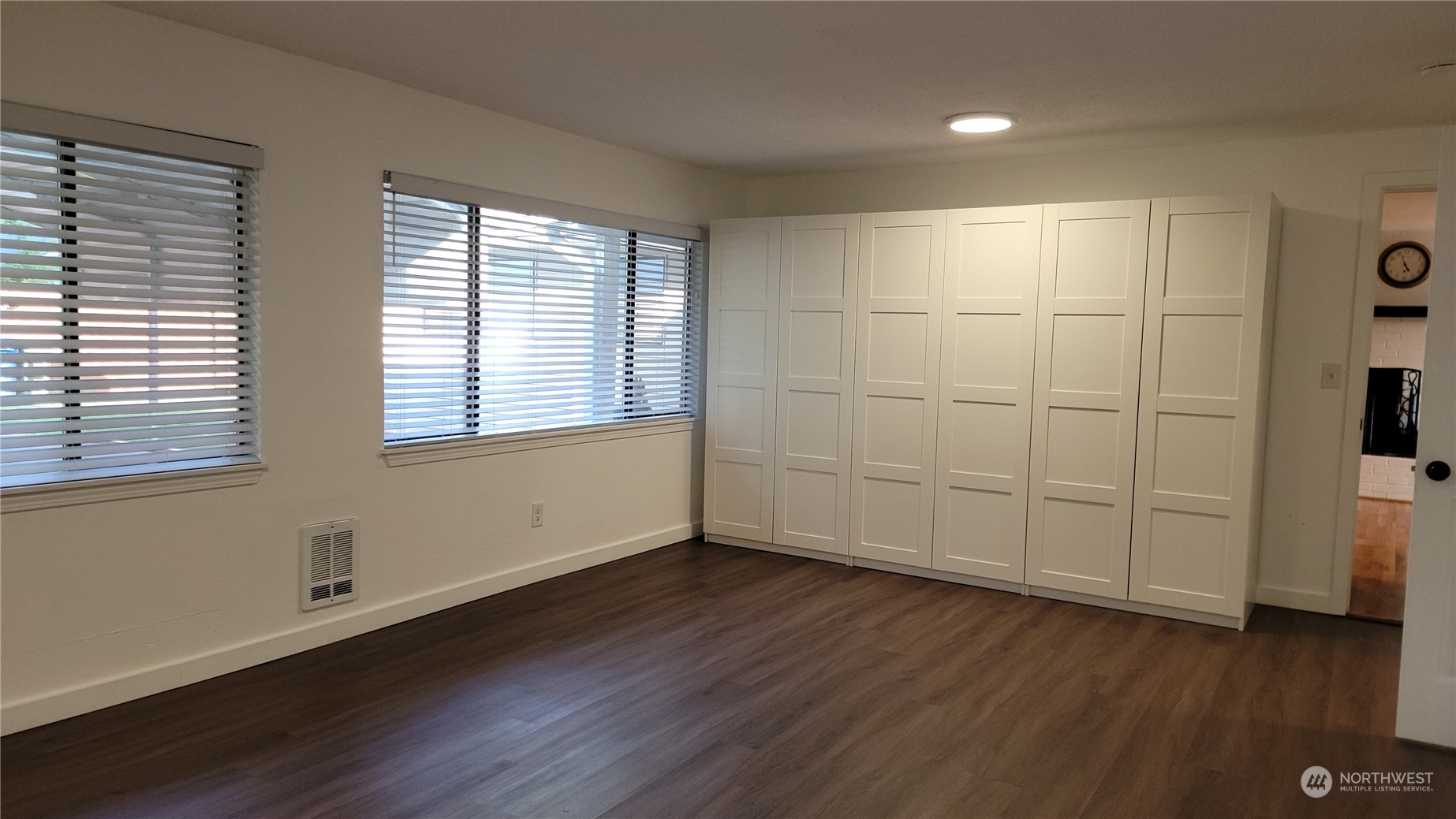 18817 Southeast 134th Street Renton, WA 98059 - Photo 19 of 27 a view of an empty room with wooden floor and a window