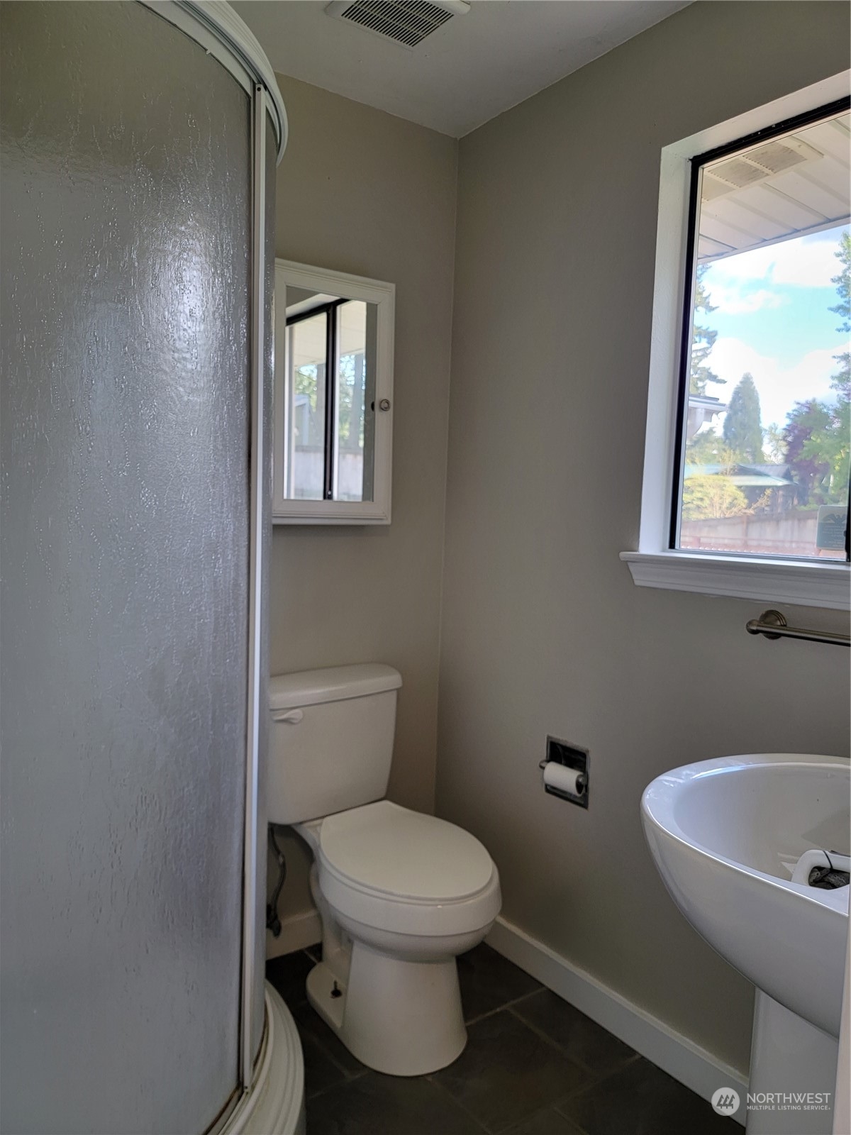 18817 Southeast 134th Street Renton, WA 98059 - Photo 20 of 27 a bathroom with a toilet a sink and a window