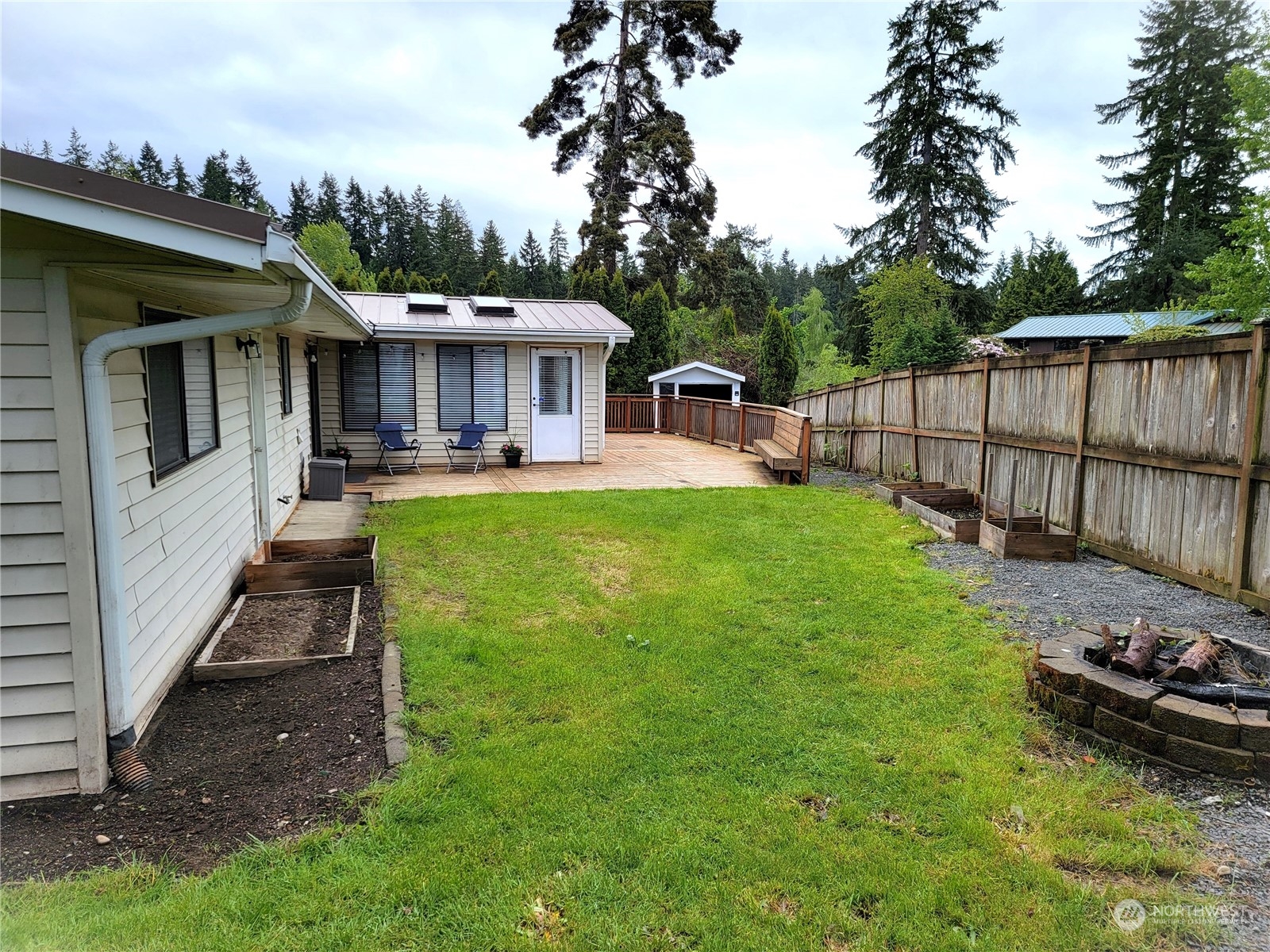 18817 Southeast 134th Street Renton, WA 98059 - Photo 21 of 27 a view of a house with backyard and sitting area