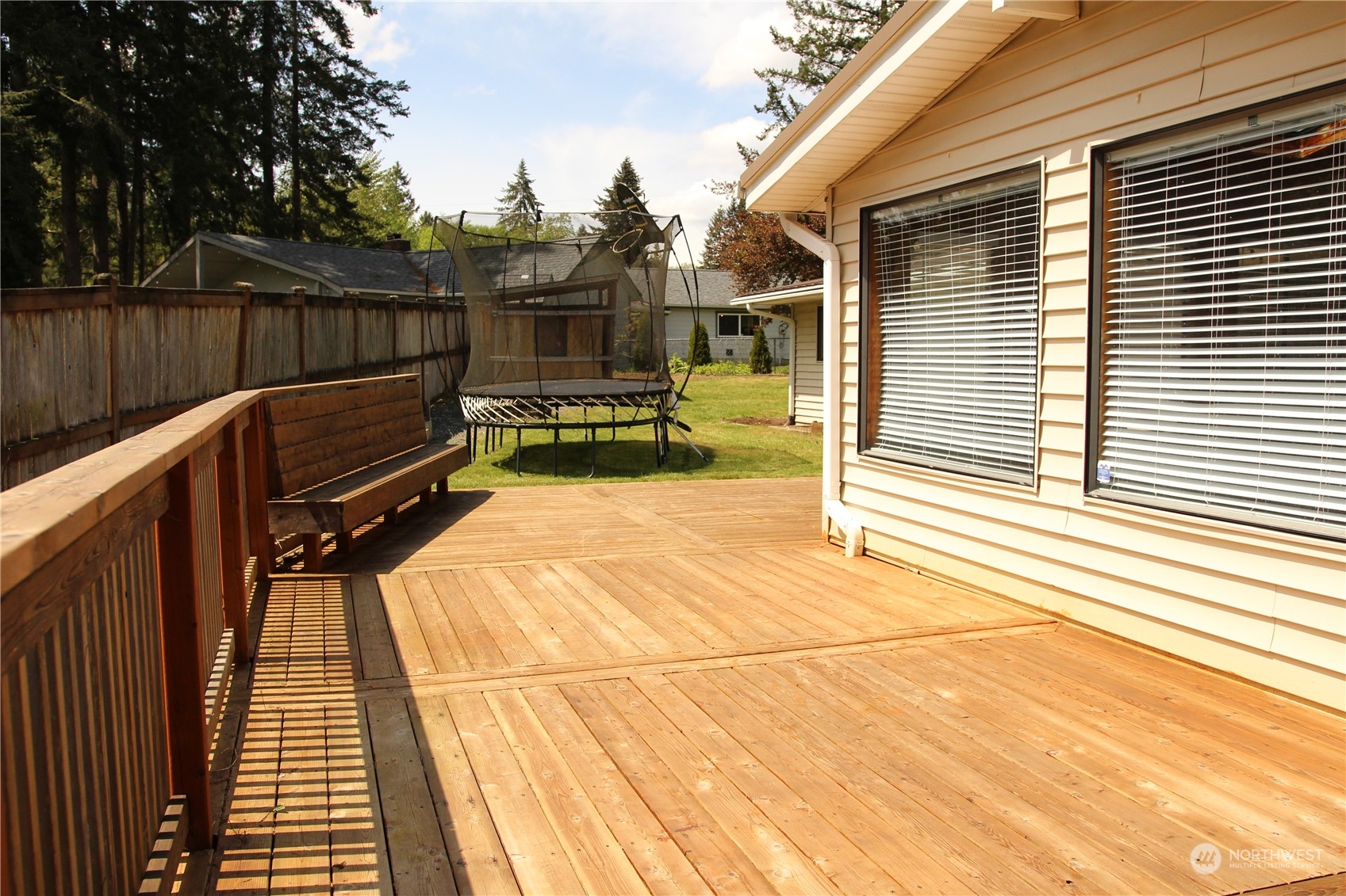 18817 Southeast 134th Street Renton, WA 98059 - Photo 23 of 27 a view of a roof deck with wooden floor and outdoor seating