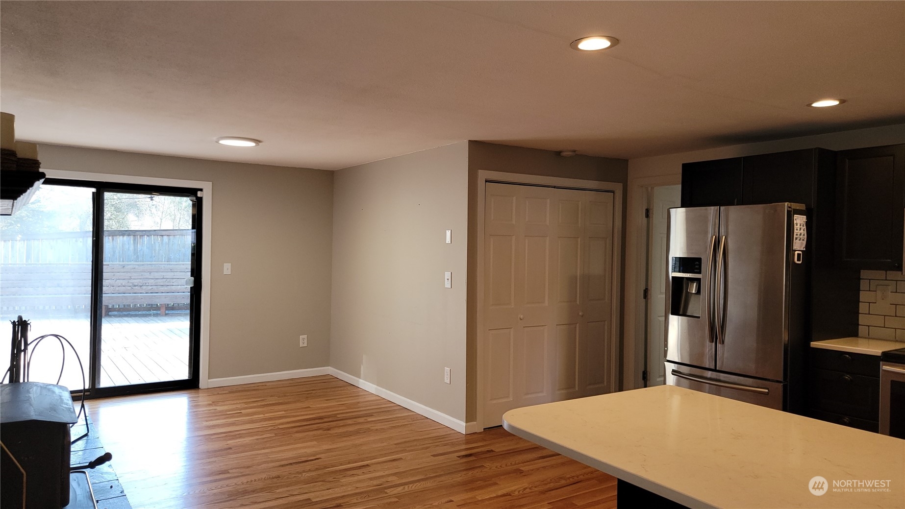 18817 Southeast 134th Street Renton, WA 98059 - Photo 3 of 27 a kitchen with stainless steel appliances a refrigerator and wooden floor