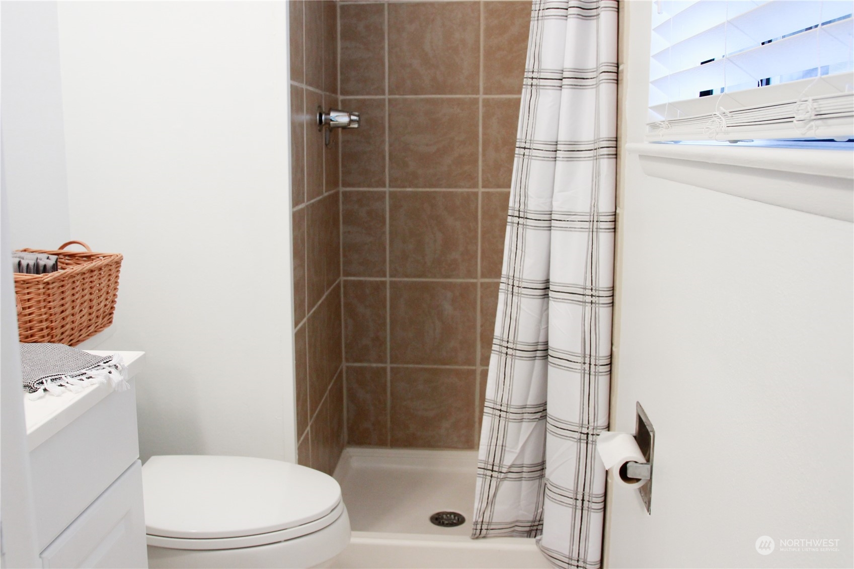 18817 Southeast 134th Street Renton, WA 98059 - Photo 10 of 27 a bathroom with a toilet and shower