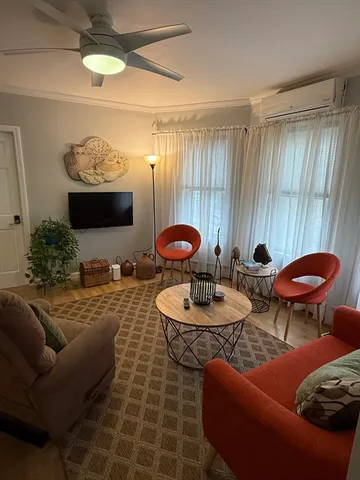 a view of a livingroom with furniture and window