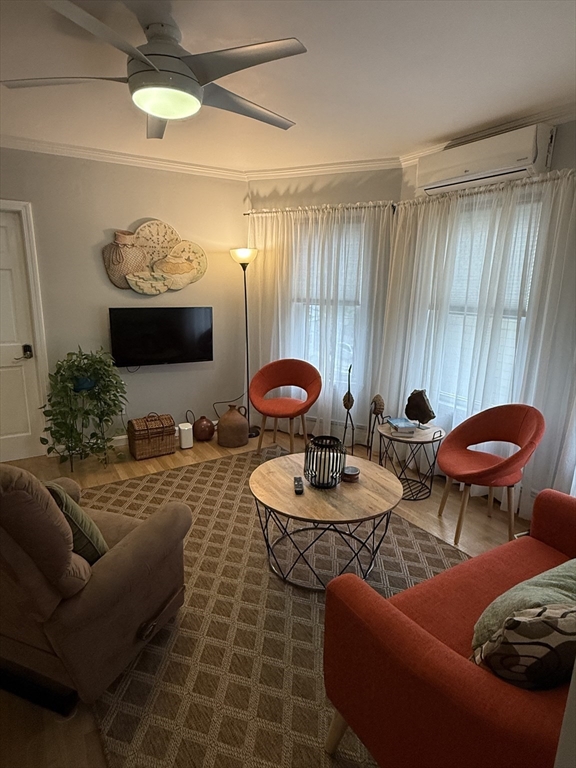 159 Walnut Street, Unit 2 Somerville, MA 02145 - Photo 5 of 10 a view of a livingroom with furniture and window