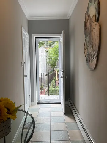 a view of a door and chair in a room