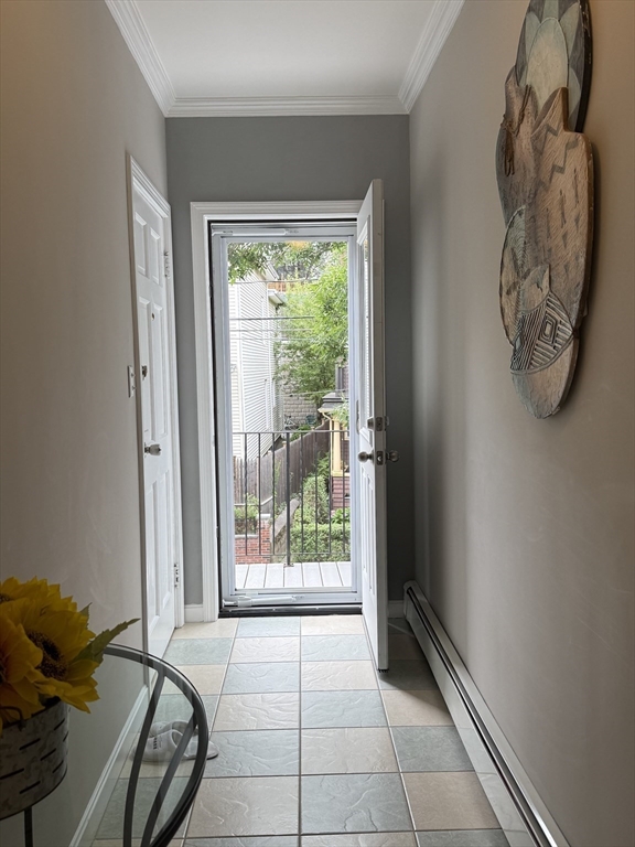 159 Walnut Street, Unit 2 Somerville, MA 02145 - Photo 8 of 10 a view of a door and chair in a room