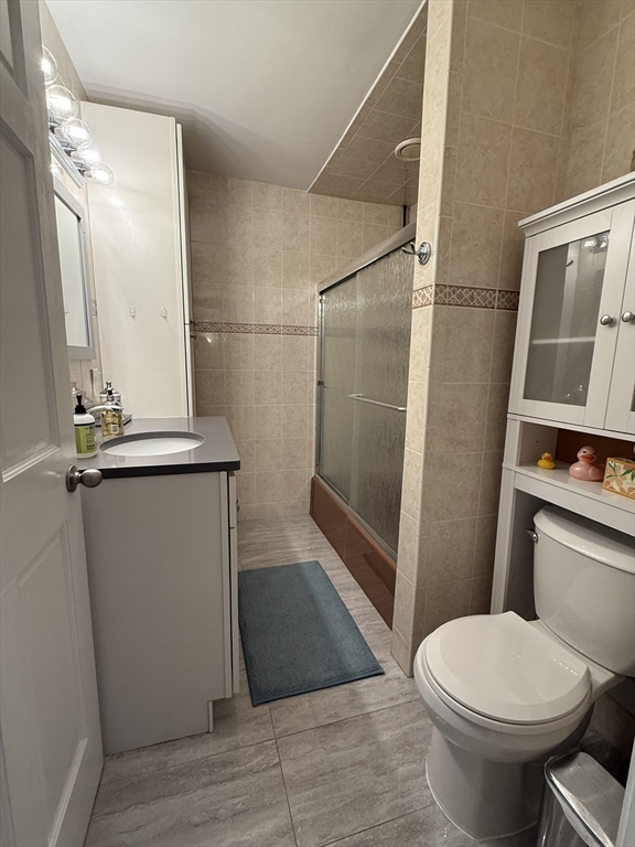 159 Walnut Street, Unit 2 Somerville, MA 02145 - Photo 10 of 10 a bathroom with a toilet and a shower