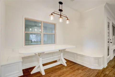 a room with a table and chairs