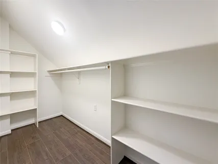 a view of an empty walk in closet