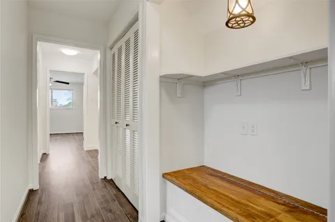 a view of a room with wooden floor and closet