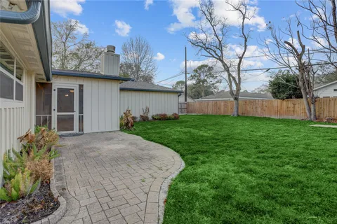a view of a house with a back yard
