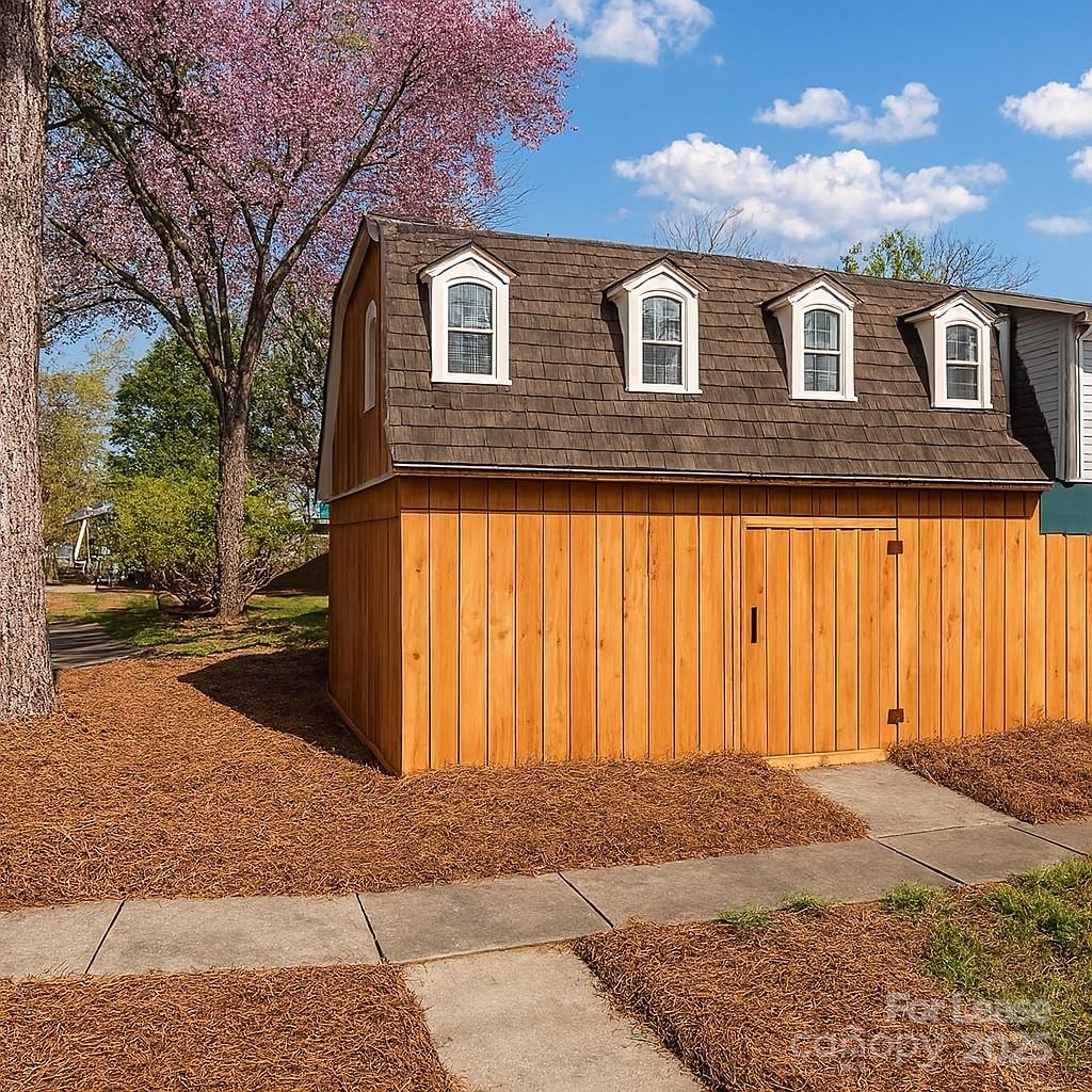 5821 Hunting Ridge Lane, Unit F Charlotte, NC 28212 - Photo 5 of 16 a front view of a house with a yard