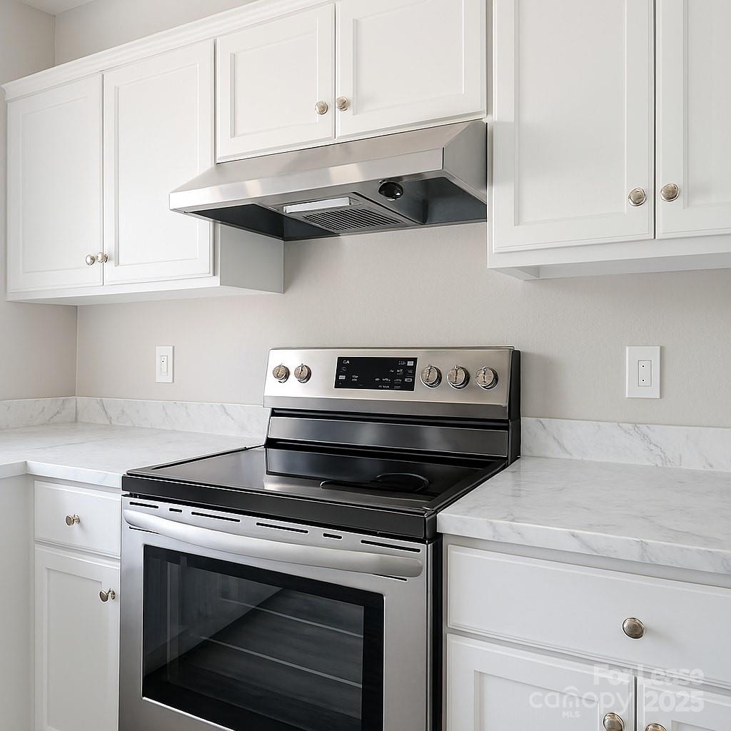 5821 Hunting Ridge Lane, Unit F Charlotte, NC 28212 - Photo 7 of 16 a stove top oven sitting inside of a kitchen