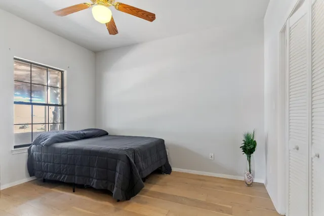 a view of a house with backyard and trees