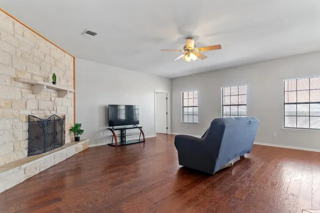 a bathroom with a sink vanity granite and a mirror