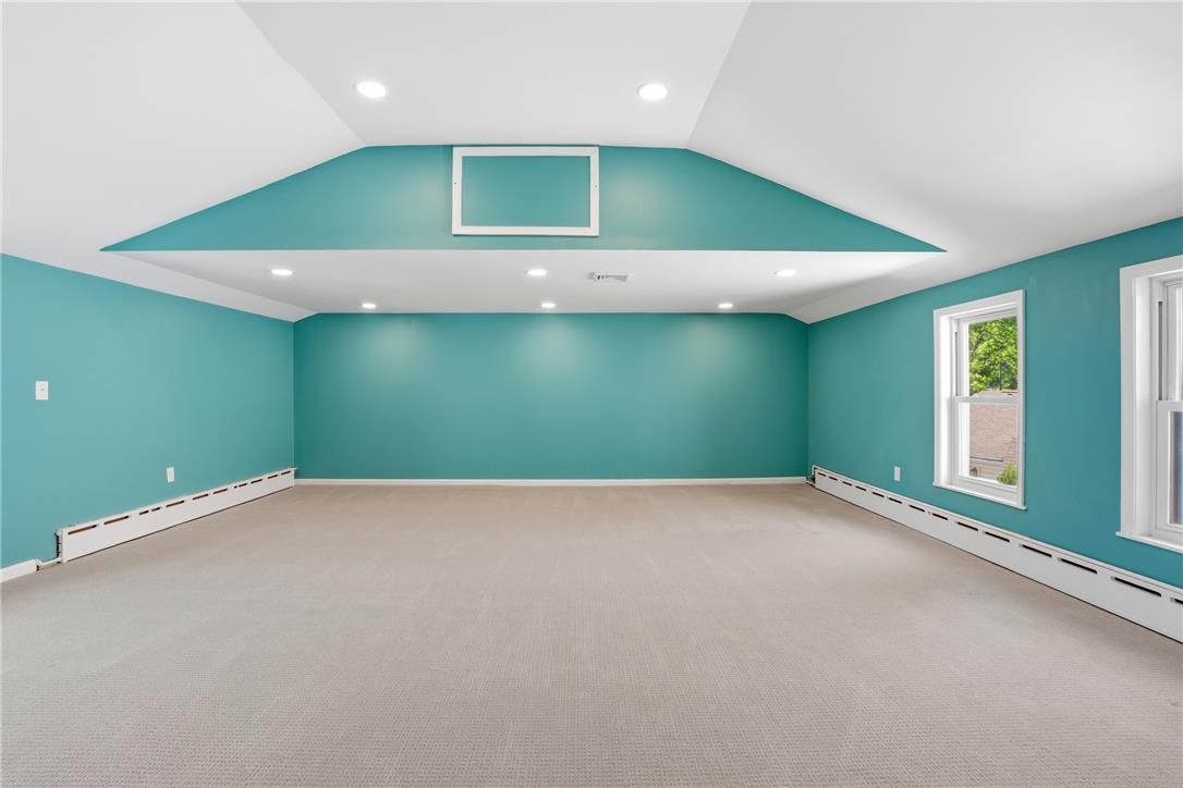 6271 Batman Road Zionsville, PA 18092 - Photo 61 of 100 An inviting atmosphere is created by plush carpeting and recessed lighting in this well-lit room.