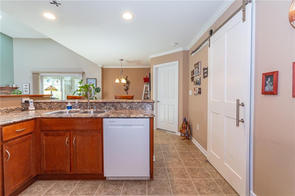 425 Chestnut Lane Apollo, PA 15613 - Photo 11 of 48 a bathroom with a granite countertop sink a mirror and a bathtub