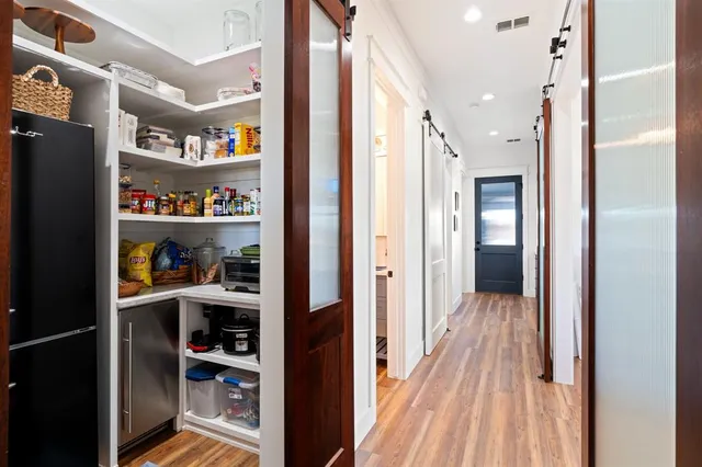 a view of a hallway with shelves