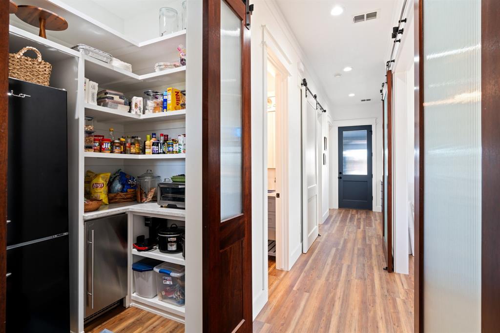 714 Bethel Road Waxahachie, TX 75167 - Photo 15 of 40 a view of a hallway with shelves
