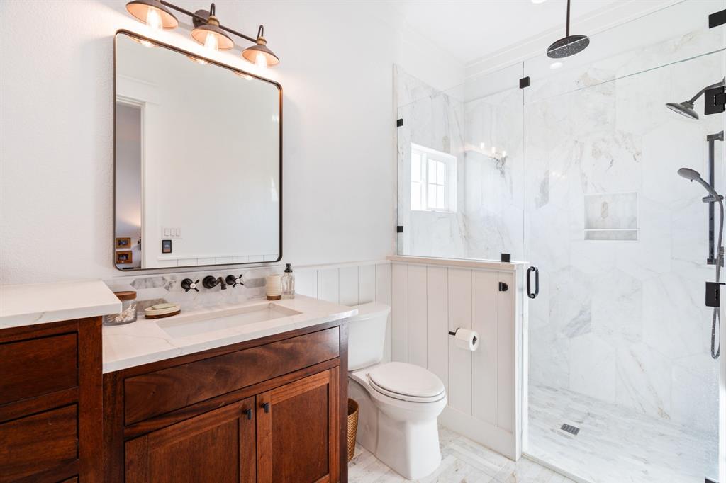 714 Bethel Road Waxahachie, TX 75167 - Photo 22 of 40 a bathroom with a sink a toilet and shower