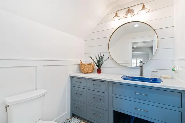 a bathroom with a sink and mirror