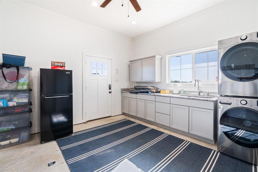 714 Bethel Road Waxahachie, TX 75167 - Photo 35 of 40 a kitchen with a refrigerator and a stove top oven