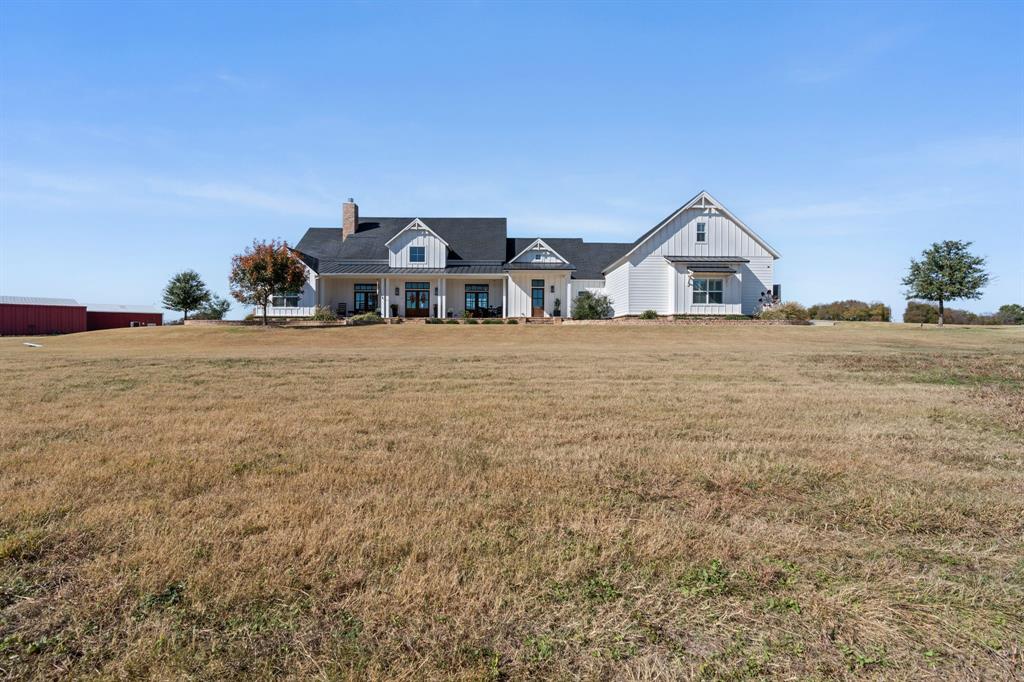 714 Bethel Road Waxahachie, TX 75167 - Photo 39 of 40 a front view of a house with a yard and garage