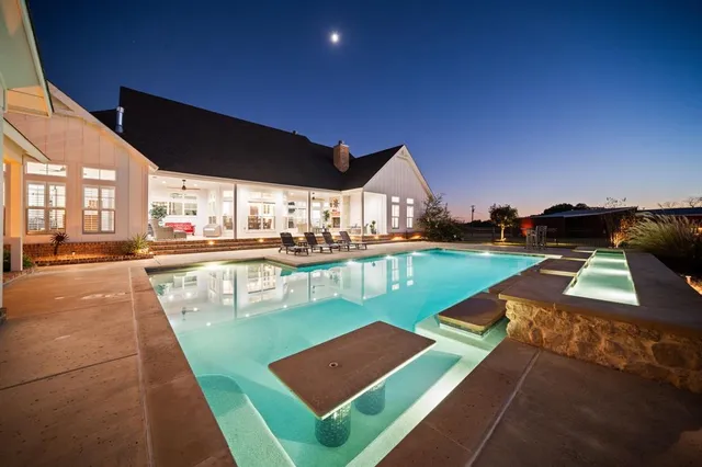 a view of a swimming pool with a lounge chairs