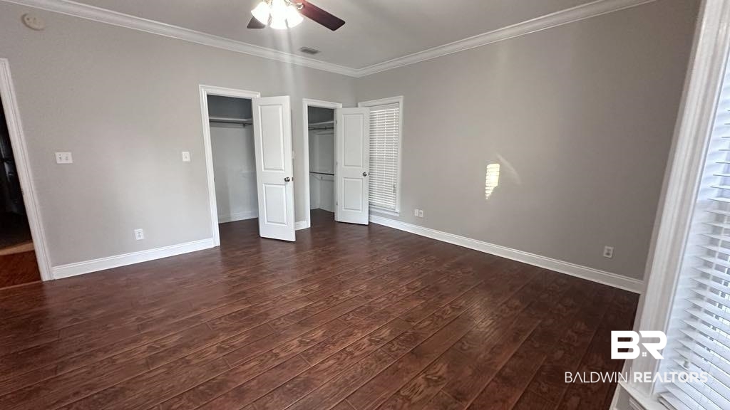 23289 McPhillips Road Loxley, AL 36551 - Photo 19 of 19 Spacious interior room featuring wood-finish flooring, light gray walls, white trim, and a ceiling fan