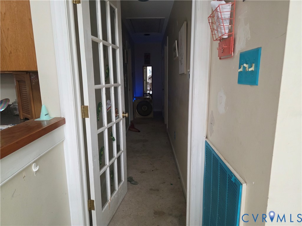 3161 Dorrell Road Aylett, VA 23009 - Photo 12 of 41 a view of a hallway with paintings on the wall