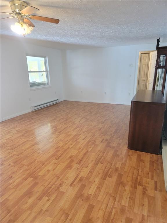 361 Waltersburgh Road Smock, PA 15480 - Photo 4 of 13 a view of wooden floor and windows in a room