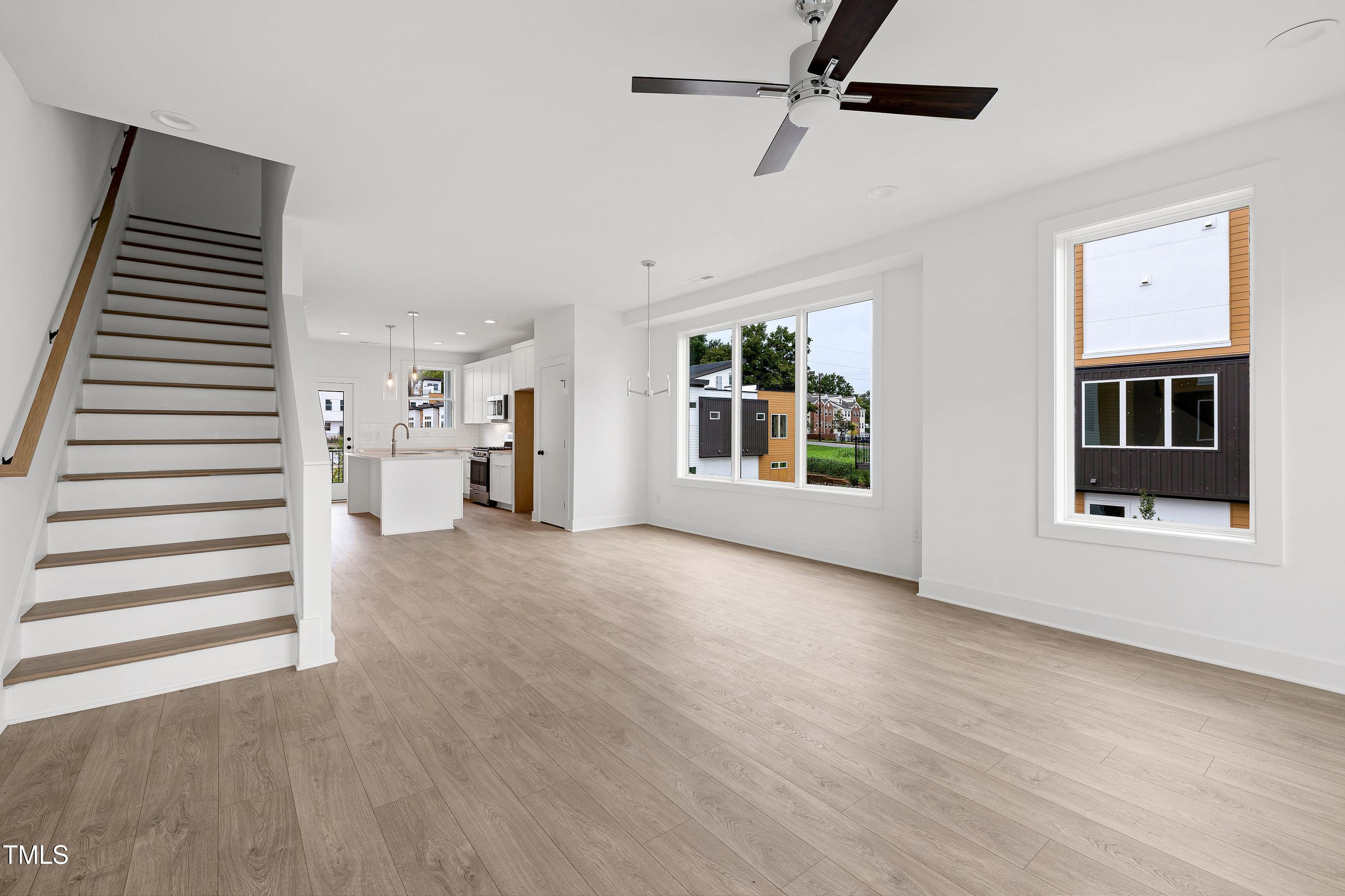 1412 Sawyer Road, Unit 101 Raleigh, NC 27610 - Photo 18 of 33 wooden floor in an empty room with a window