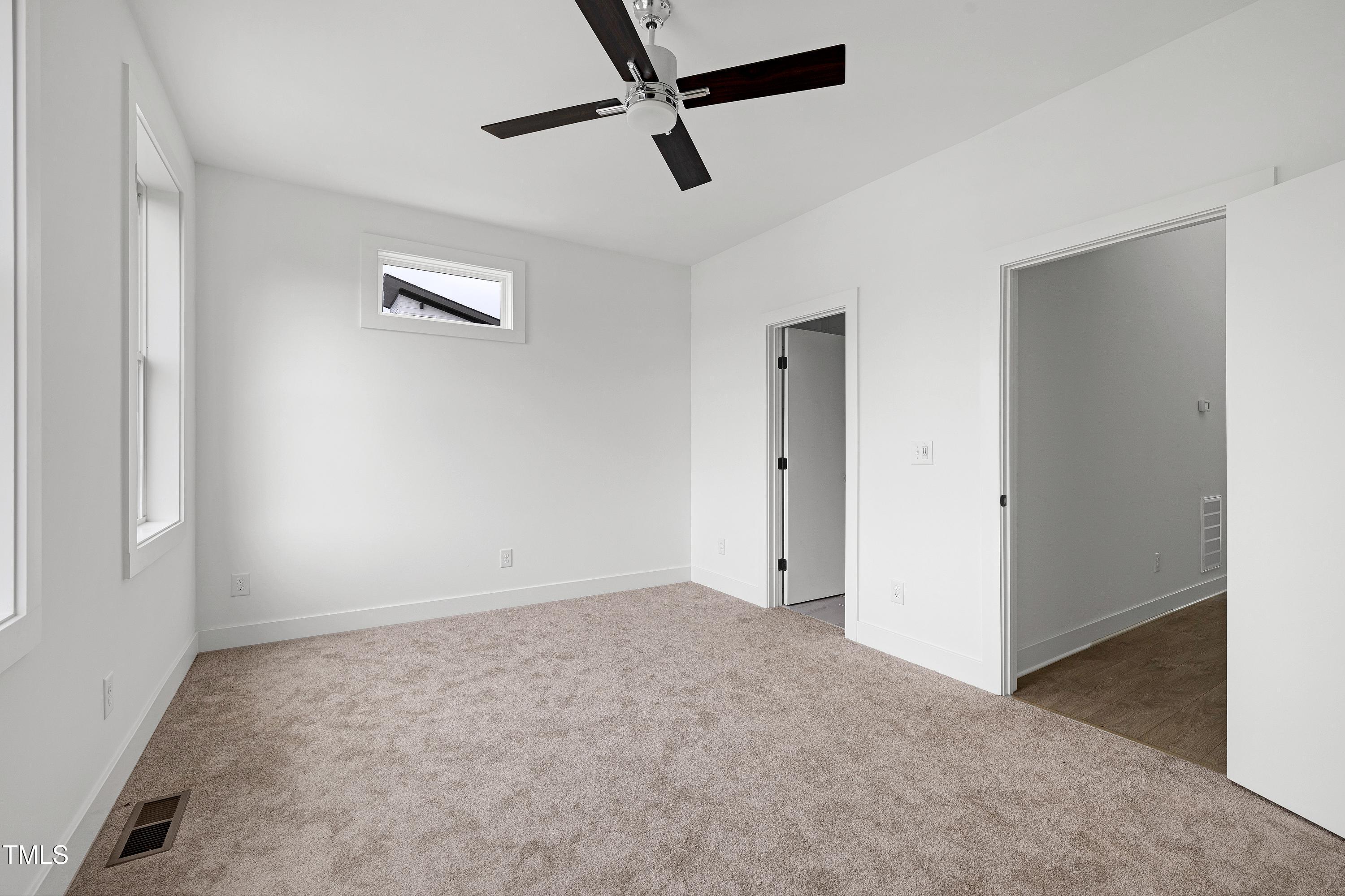 1412 Sawyer Road, Unit 101 Raleigh, NC 27610 - Photo 20 of 33 a view of empty room with ceiling fan