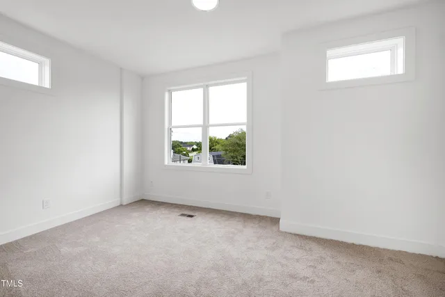 an empty room with windows