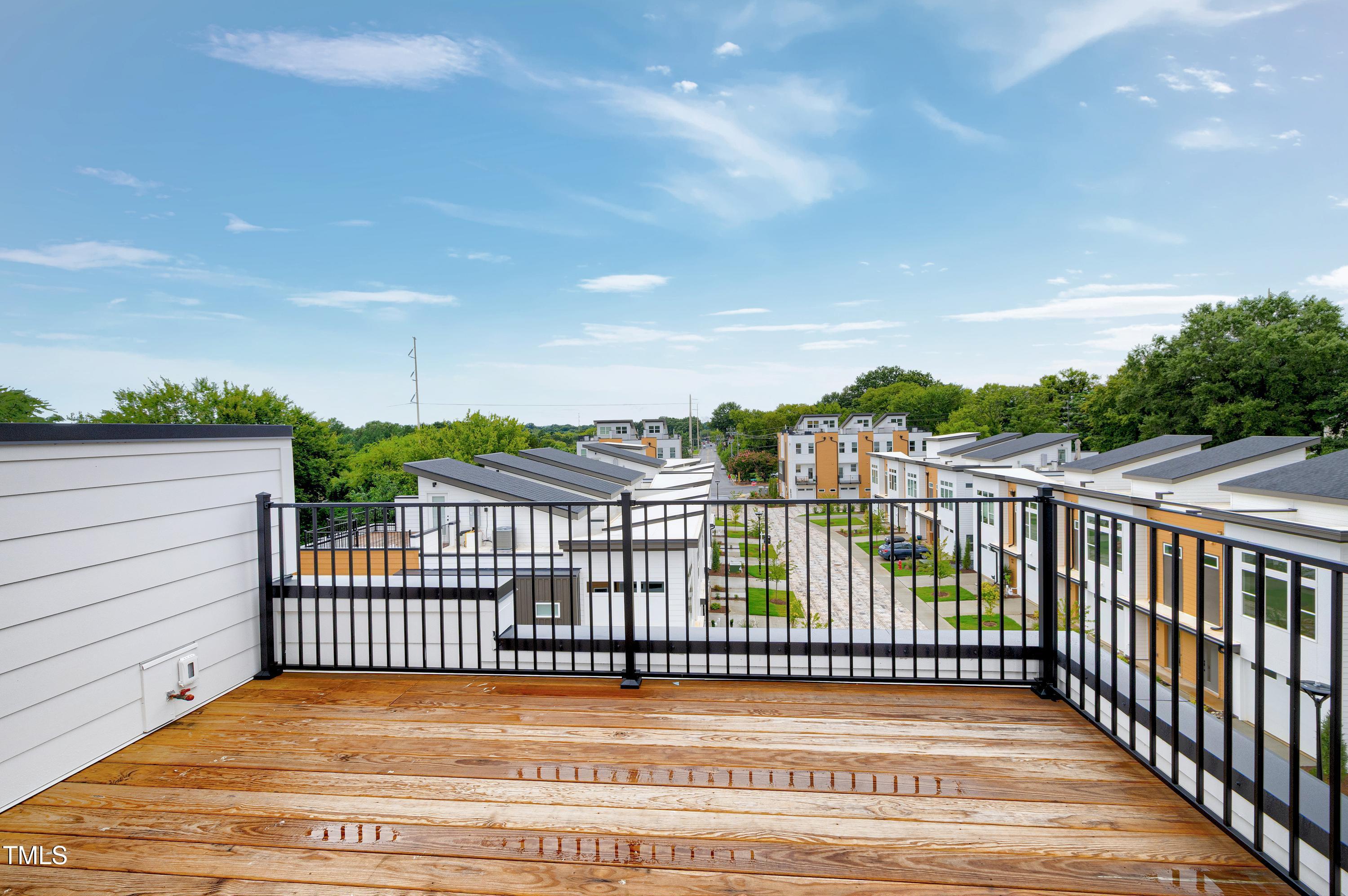 1412 Sawyer Road, Unit 101 Raleigh, NC 27610 - Photo 28 of 33 a balcony with a yard