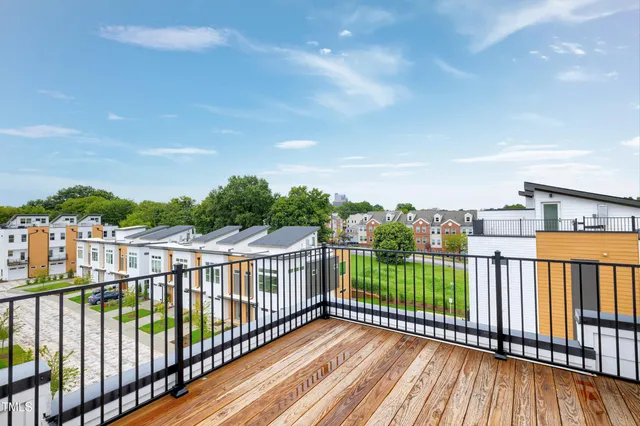 a view of a house with wooden deck
