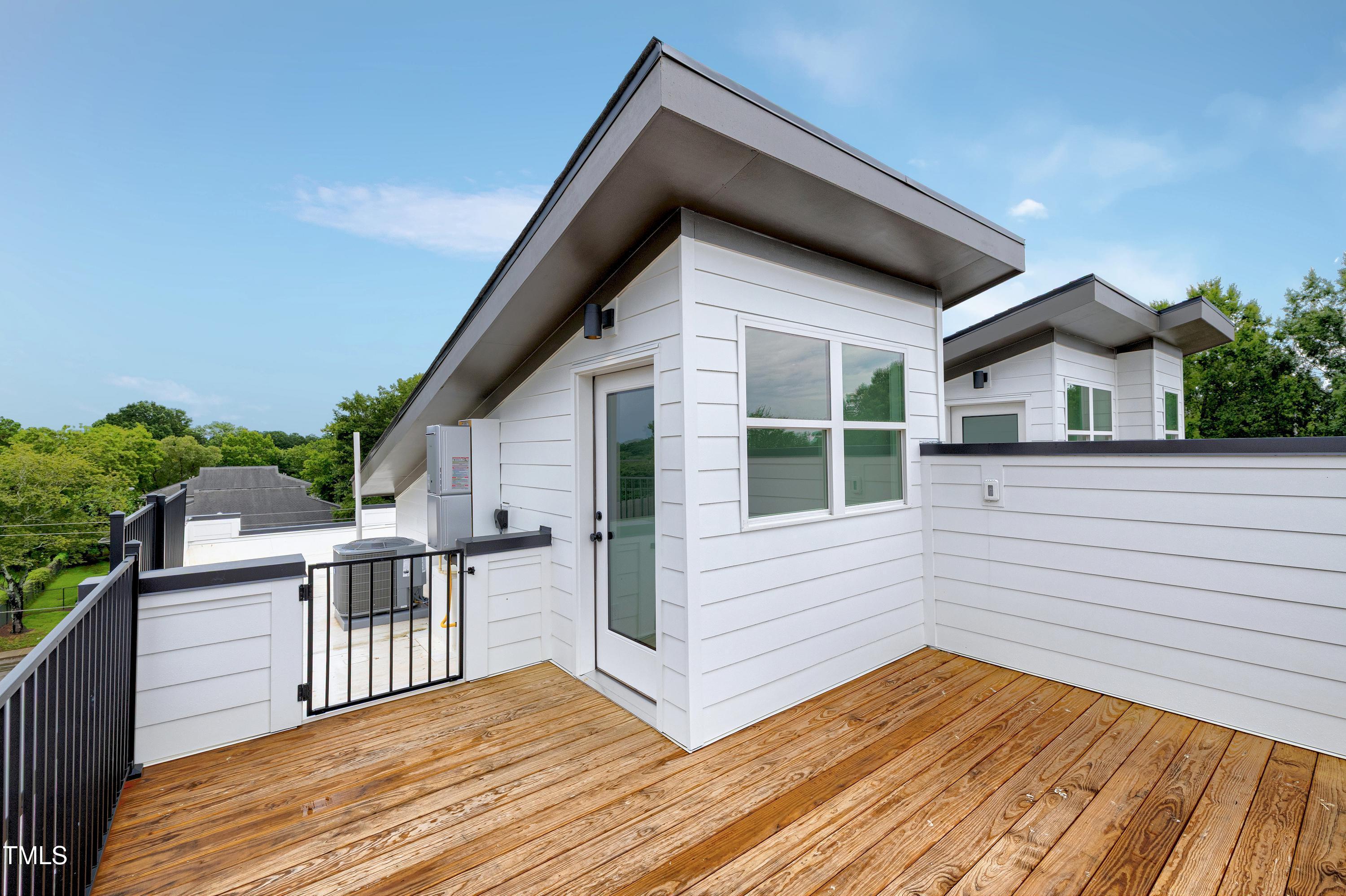 1412 Sawyer Road, Unit 101 Raleigh, NC 27610 - Photo 30 of 33 a view of a house with wooden deck