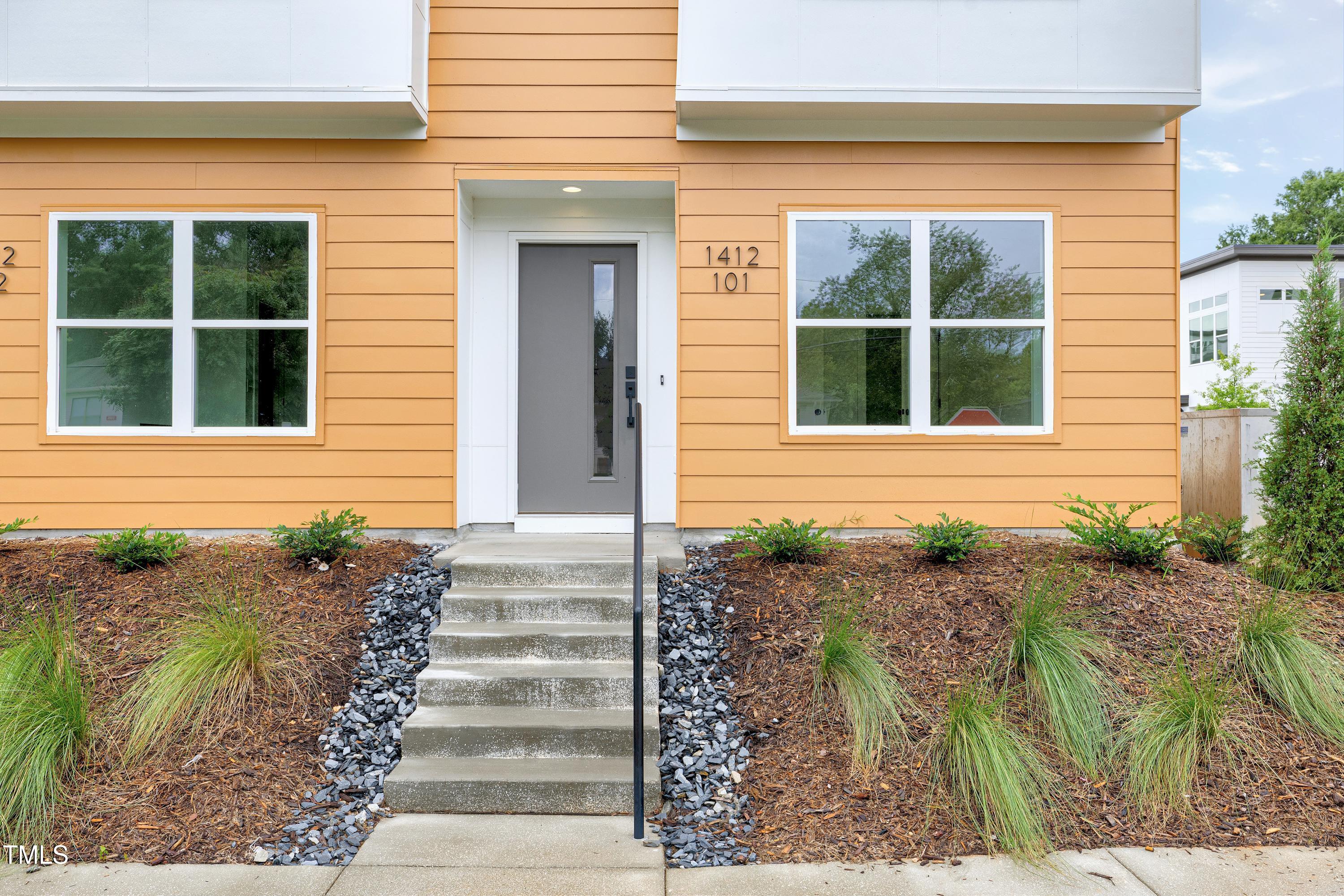 1412 Sawyer Road, Unit 101 Raleigh, NC 27610 - Photo 4 of 33 a front view of a house