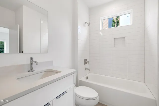 a bathroom with a sink toilet and bathtub