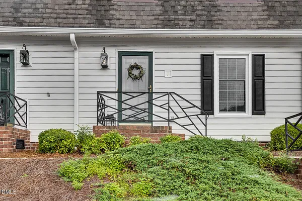a view of a house with a window and chair