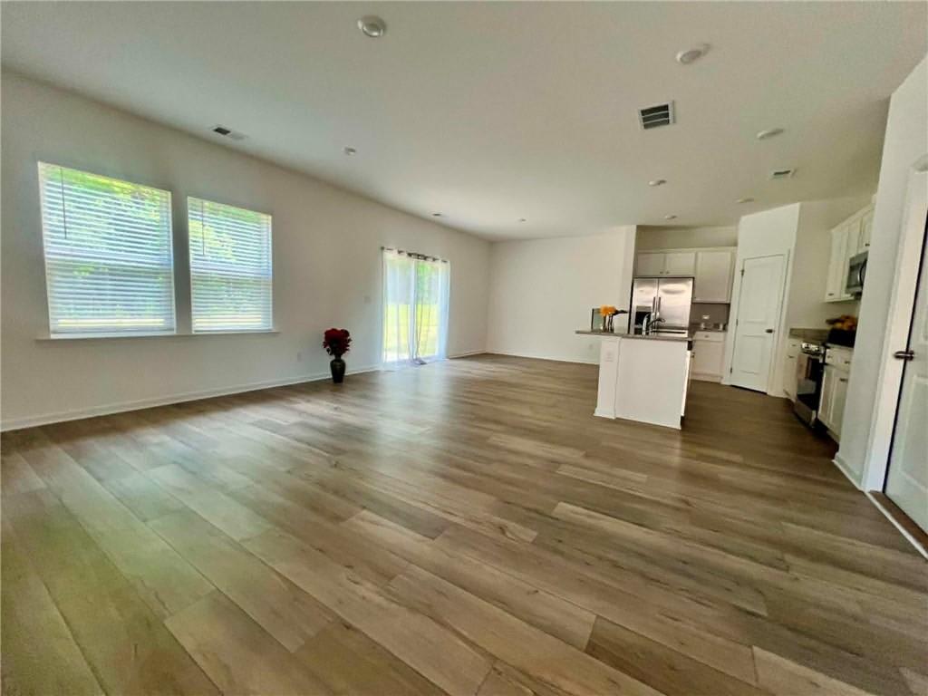 683 Evergreen Road Winder, GA 30680 - Photo 26 of 37 a view of empty room with wooden floor and window