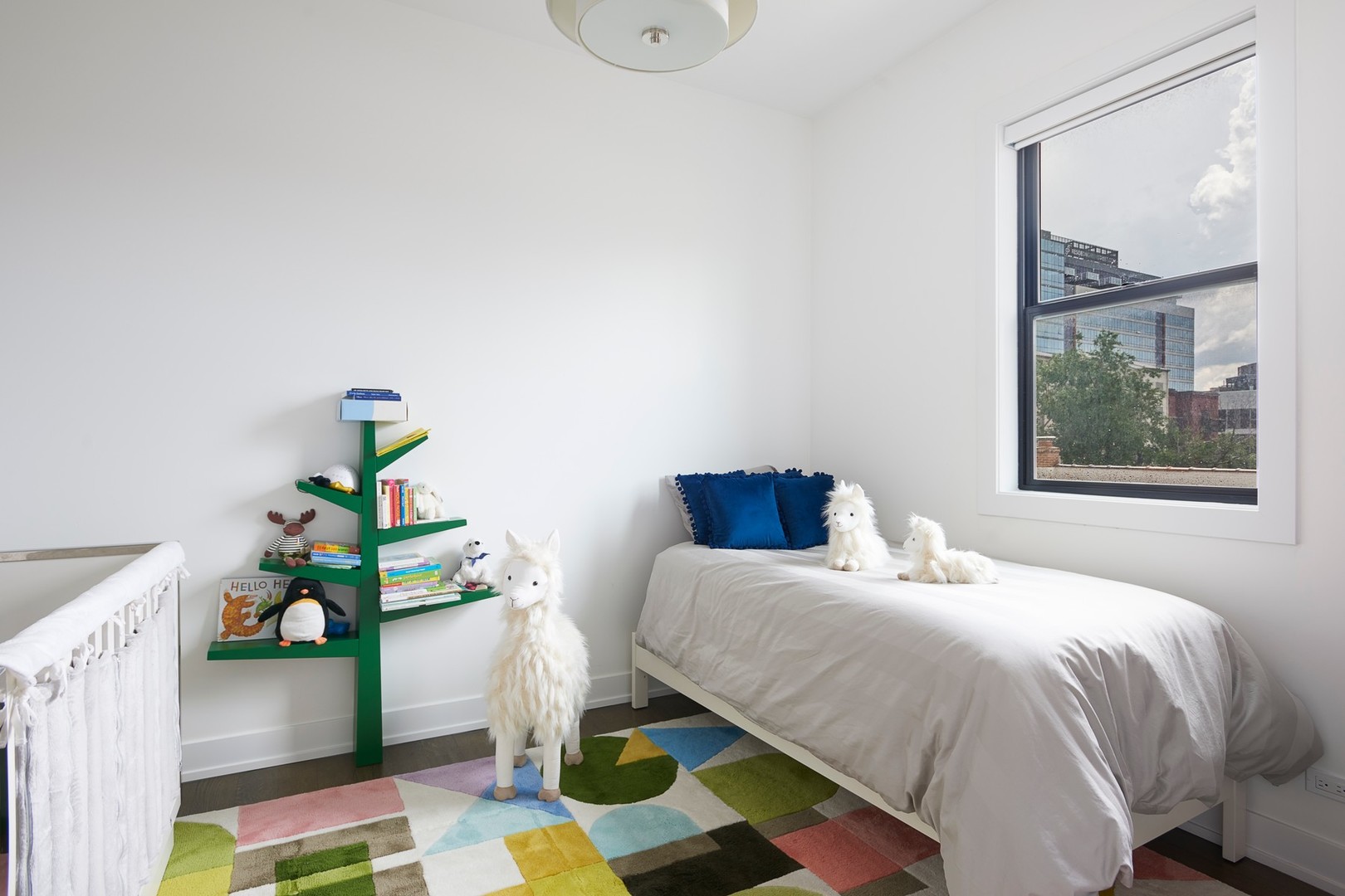 440 North Halsted Street, Unit 3A Chicago, IL 60642 - Photo 12 of 18 a bedroom with a bed table and a window