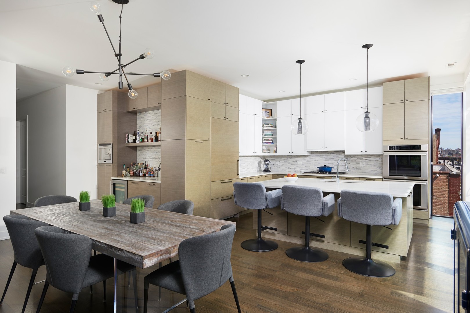440 North Halsted Street, Unit 3A Chicago, IL 60642 - Photo 3 of 18 a kitchen with a table and chairs in it