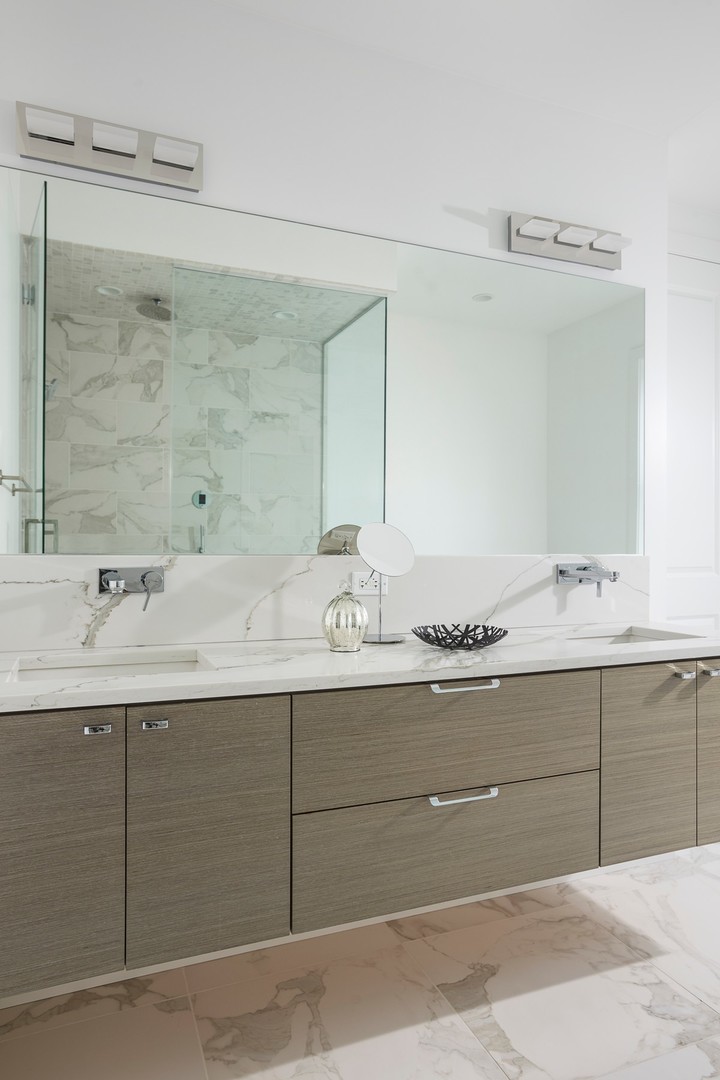 440 North Halsted Street, Unit 3A Chicago, IL 60642 - Photo 9 of 18 a bathroom with a sink and mirror